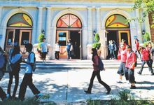Kids walking in front of the school