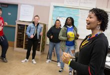 A choir teacher directs her class