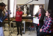 Students film a scene during a project
