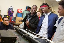 High school students work on a music project together