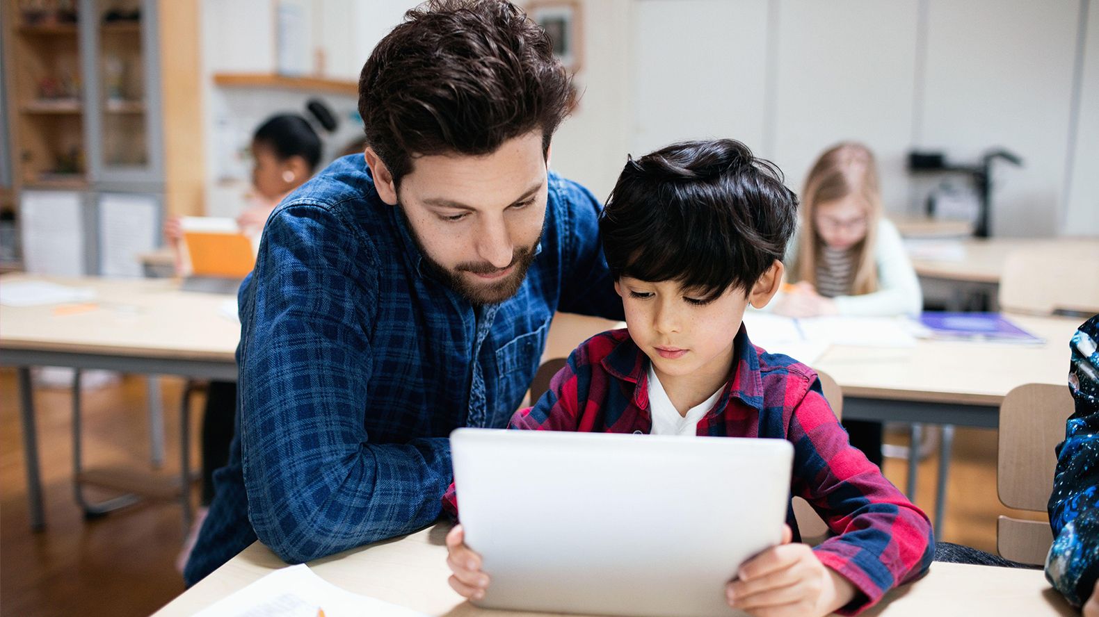 Assisting in using. Teacher Assistant