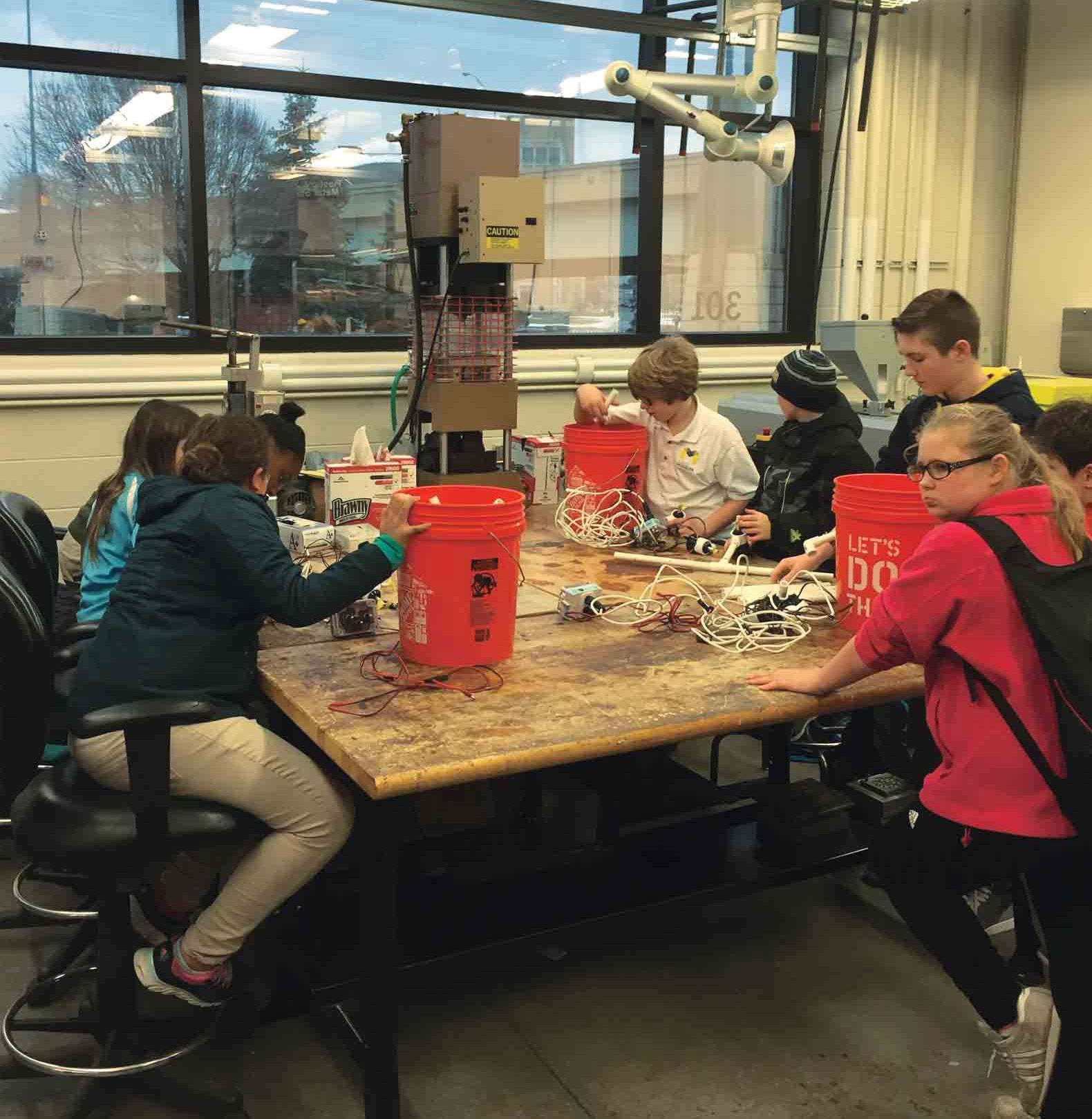 Hands-on learning occurs throughout the city for Museum School students. At Grand Valley State University, students take an underwater robotics class.