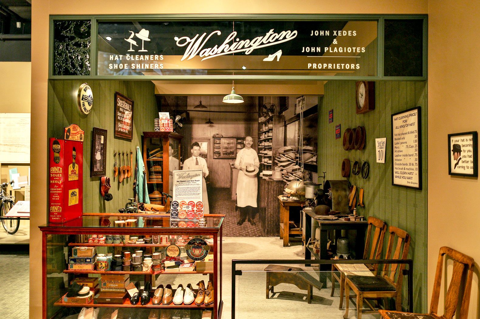 A replica of a historic Grand Rapids storefront in the “Newcomers” exhibit helps students understand the typical jobs and wages of three different immigrant groups who have settled in the area.
