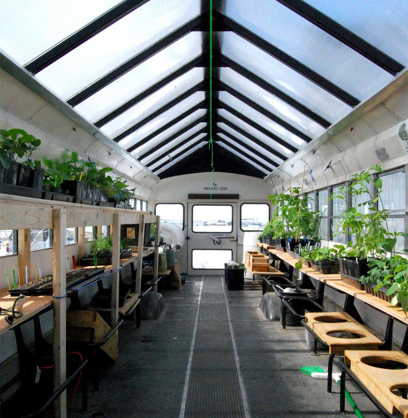 The bus seat frames were transformed into plant tables, and herbs and vegetables were planted throughout.