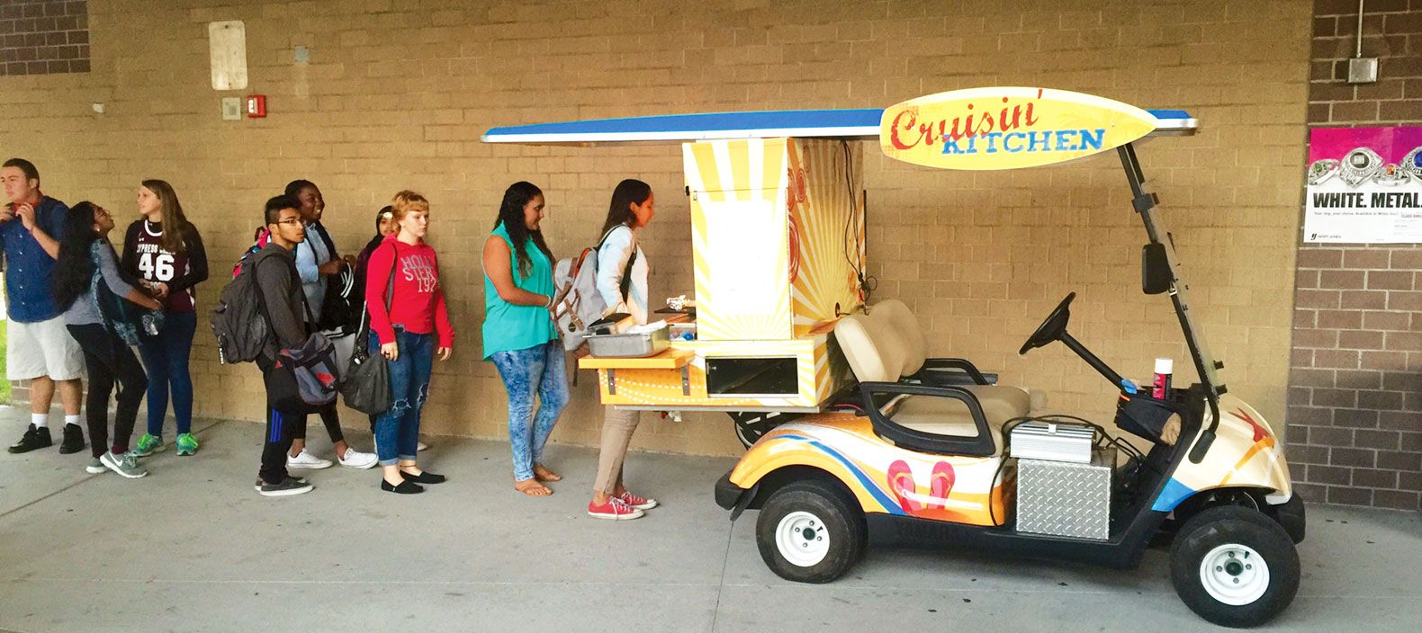 The district uses a golf cart to bring dinner to students at high-poverty schools who participate in after-school activities spread out over a large campus.