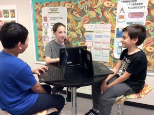 A group of students work on a project together at White Oak Elementary in Sugar Hill, Georgia.
