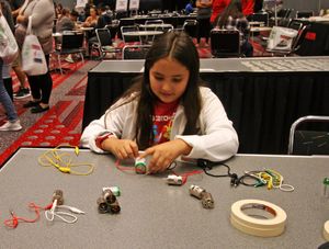 A young girl engaging in a STEM activity