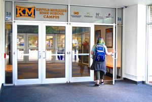 A student walks into Kettle Moraine High School.