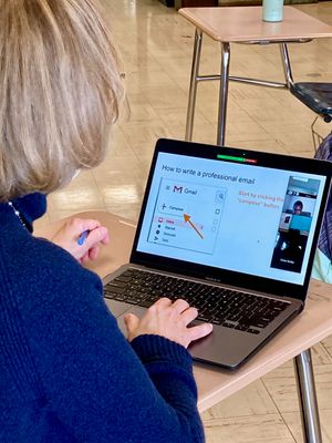 An OT shows students how to prepare an email.