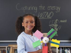 Young student with her homemade windmill project