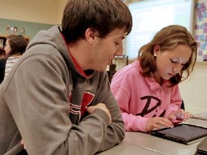 Students Looking at a Tablet