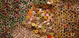 Close up of colorful metal pieces the side of bottle caps wired together