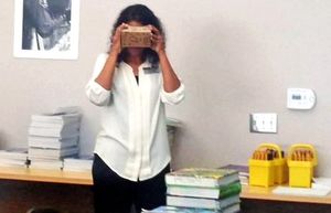 Nicol Howard standing in class trying out Google Cardboard