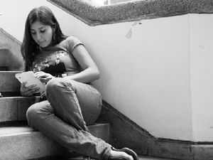 A student reading on a tablet