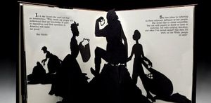 An opened pop-up book showing black silhouettes of four people working