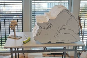 Sculpting a giant's head from Styrofoam