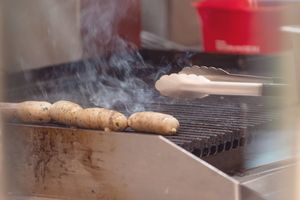 Sausages cooking on a grill